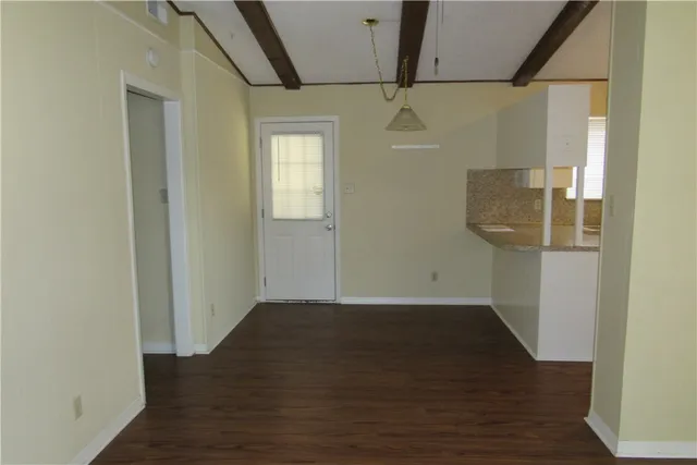 a view of hallway with wooden floor
