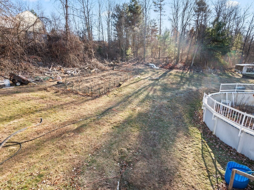 75 Lawrence Street Northborough, MA 01532 - Photo 11 of 38 a view of a yard with plants and trees