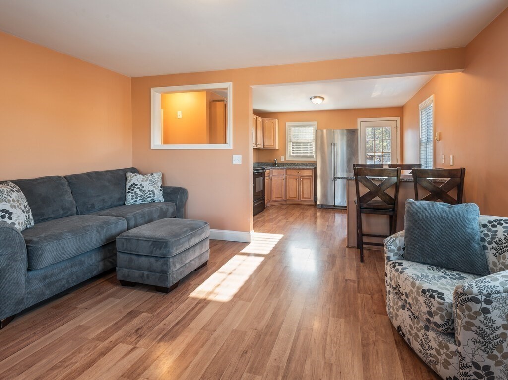 75 Lawrence Street Northborough, MA 01532 - Photo 15 of 38 a living room with furniture and wooden floor