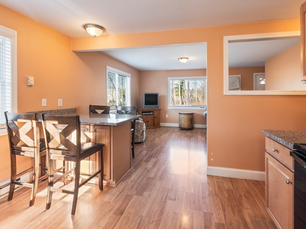 75 Lawrence Street Northborough, MA 01532 - Photo 20 of 38 a view of a kitchen with kitchen island wooden floors and stainless steel appliances