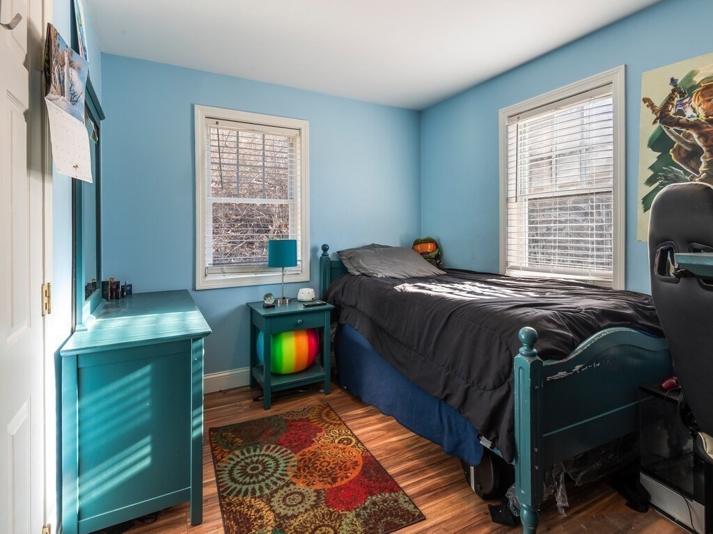 75 Lawrence Street Northborough, MA 01532 - Photo 24 of 38 a bed sitting in a bedroom next to a window