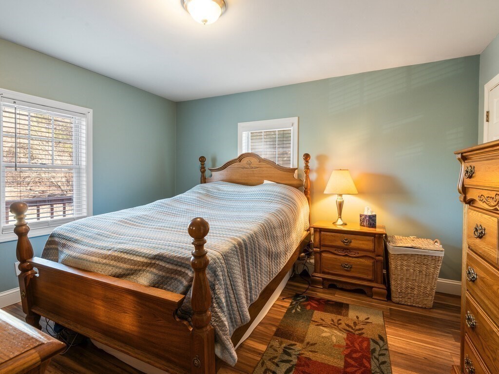 75 Lawrence Street Northborough, MA 01532 - Photo 26 of 38 a bed sitting in a bedroom next to a window