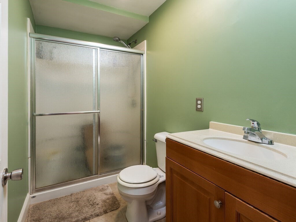 75 Lawrence Street Northborough, MA 01532 - Photo 29 of 38 a bathroom with a sink a toilet and shower