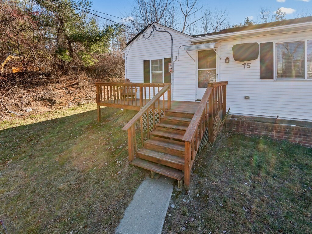 75 Lawrence Street Northborough, MA 01532 - Photo 3 of 38 a view of a house with backyard and wooden fence