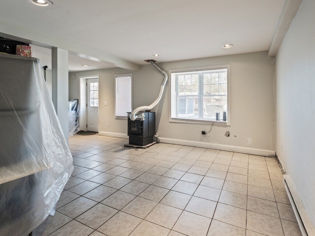 75 Lawrence Street Northborough, MA 01532 - Photo 34 of 38 a view of empty room with wooden floor and fan