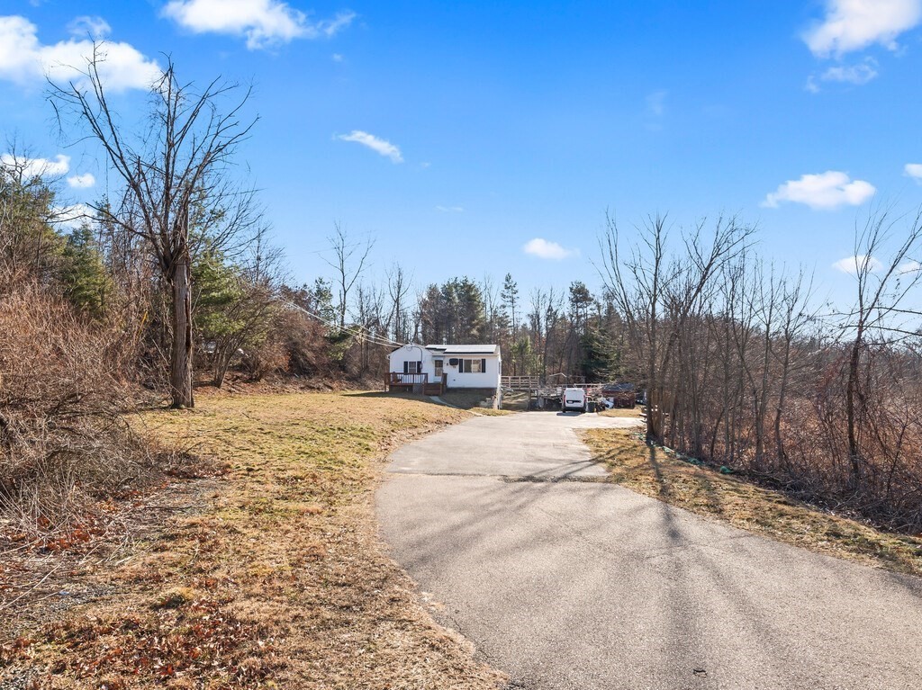 75 Lawrence Street Northborough, MA 01532 - Photo 6 of 38 a house with trees in front of it
