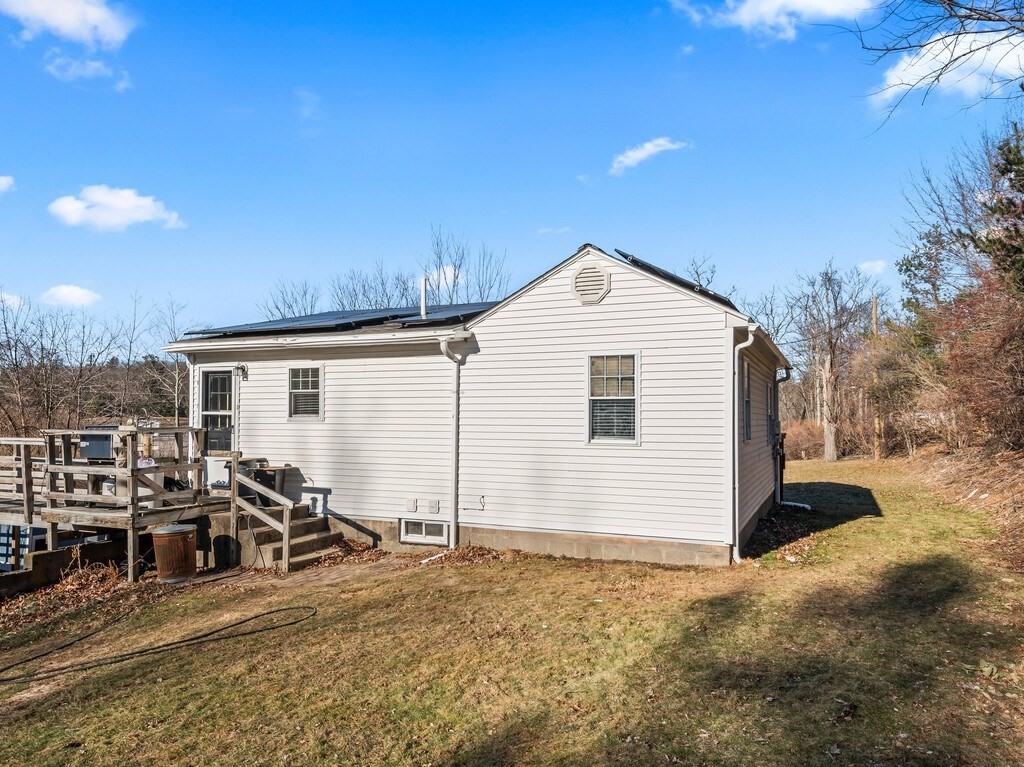 75 Lawrence Street Northborough, MA 01532 - Photo 7 of 38 a view of a house with backyard