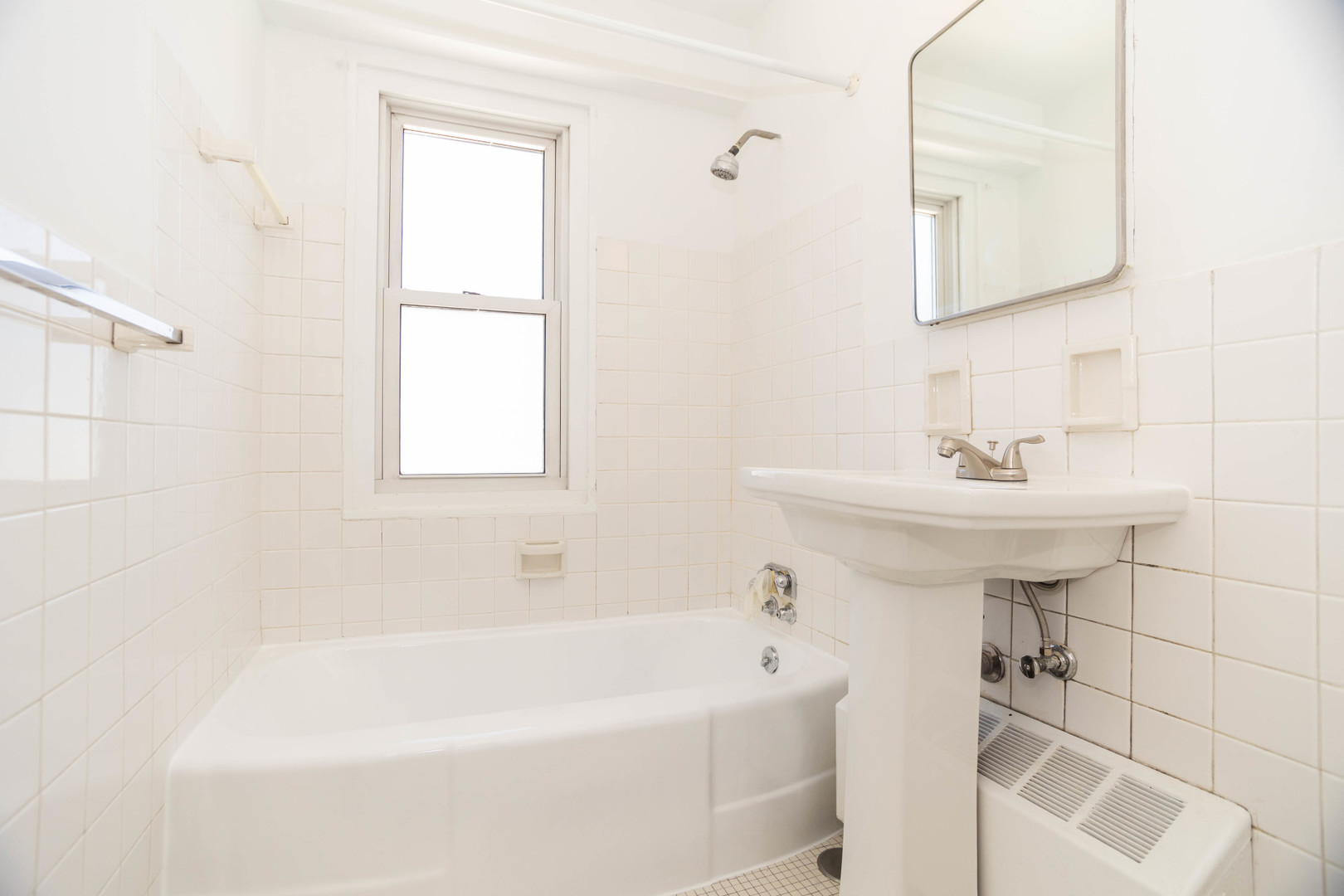 2909 North Sheridan Road, Unit 1701 Chicago, IL 60657 - Photo 14 of 16 a bathroom with a sink a bathtub and a shower