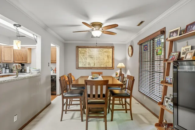 a dining room with furniture and window