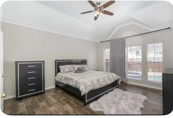 a bedroom with a bed and window