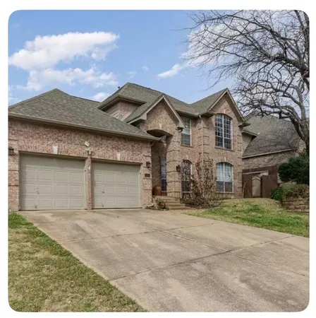 front view of a house with a dry yard