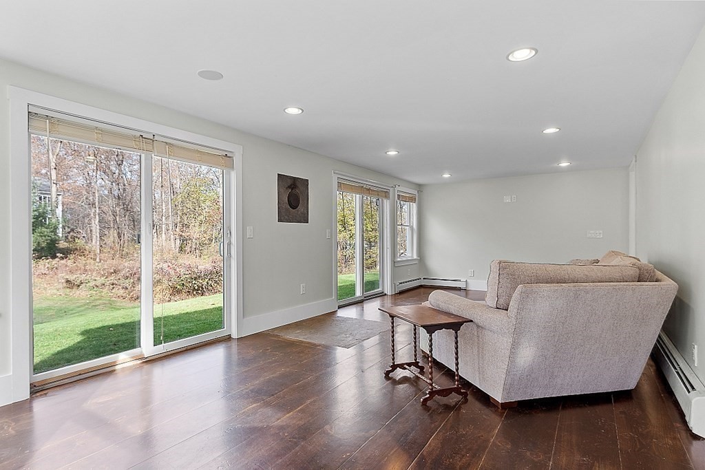 91 Gilchrest Street Lunenburg, MA 01462 - Photo 27 of 38 a living room with furniture and wooden floor