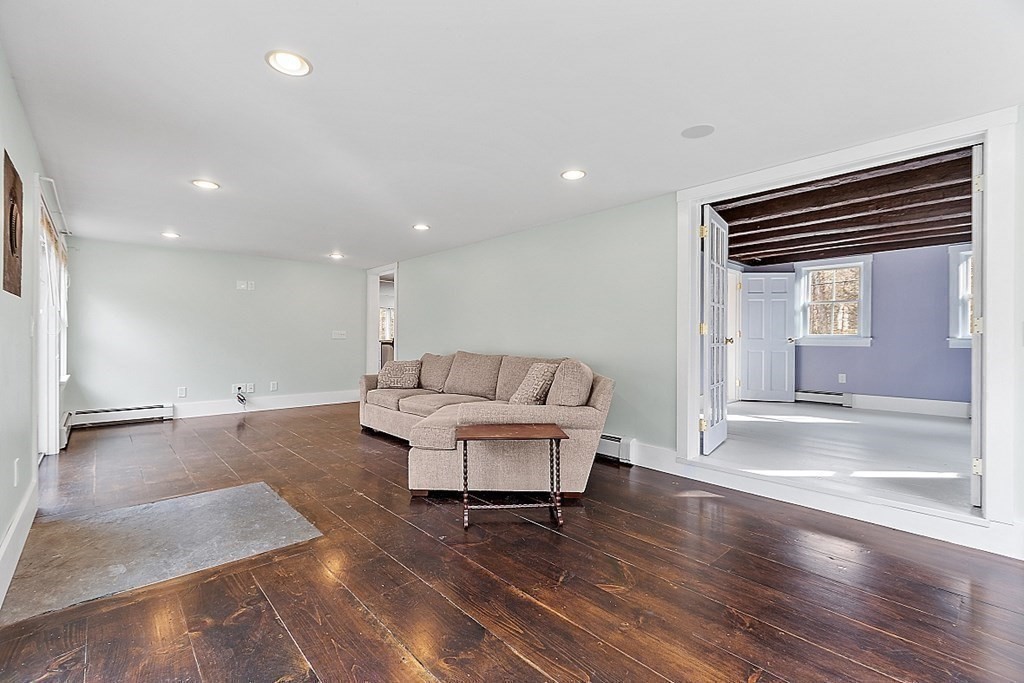 91 Gilchrest Street Lunenburg, MA 01462 - Photo 28 of 38 a living room with furniture and a wooden floor