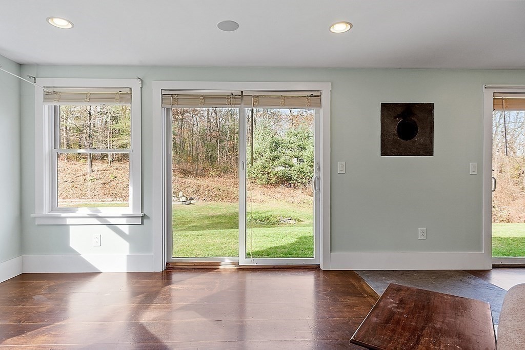 91 Gilchrest Street Lunenburg, MA 01462 - Photo 29 of 38 a view of room with window and wooden floor