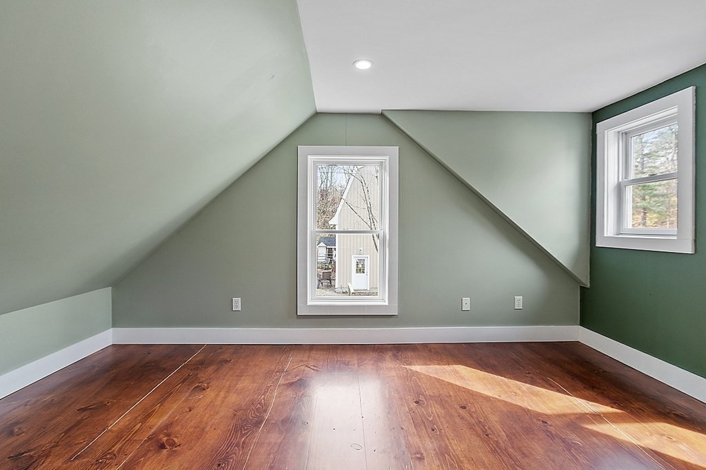 91 Gilchrest Street Lunenburg, MA 01462 - Photo 30 of 38 a view of empty room with window and wooden floor