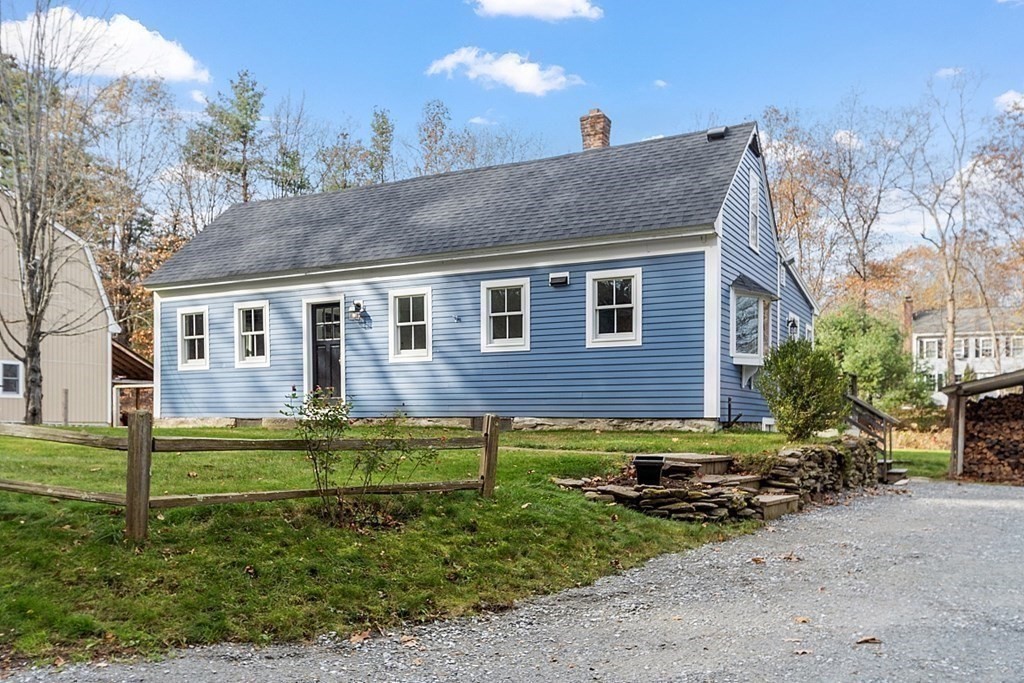 91 Gilchrest Street Lunenburg, MA 01462 - Photo 3 of 38 a front view of a house with a yard