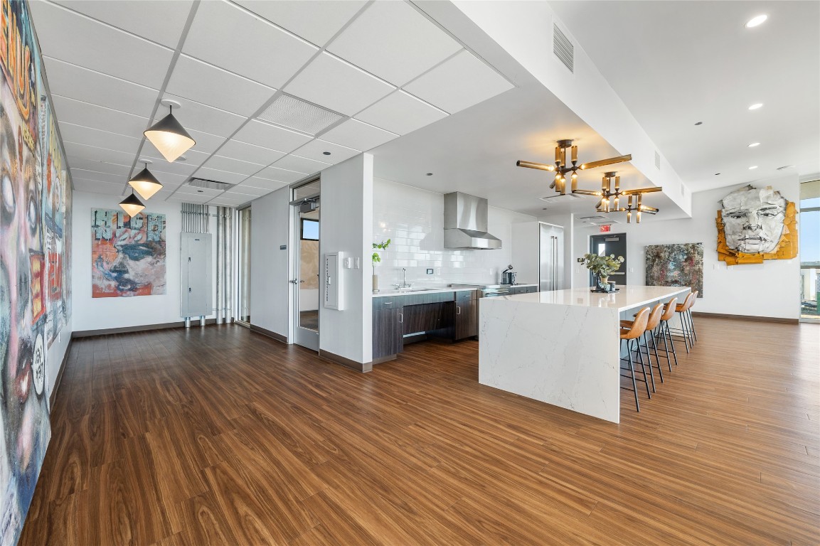 4229 North FM 620, Unit 225 Austin, TX 78734 - Photo 20 of 29 a view of a kitchen and kitchen with furniture wooden floor and window