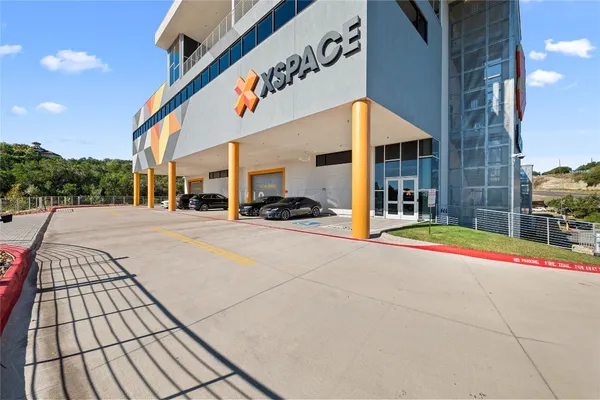 a outdoor view of a building with traffic signal lights