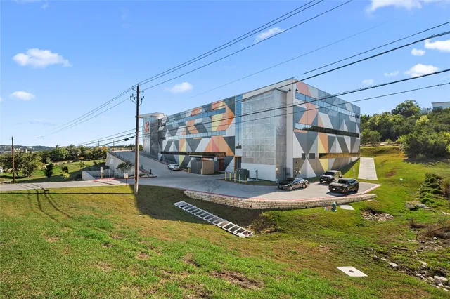 a view of a swimming pool with a yard
