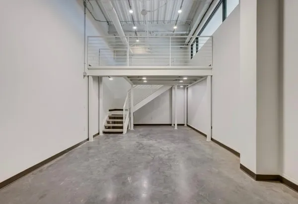 a view of an empty room with a fireplace