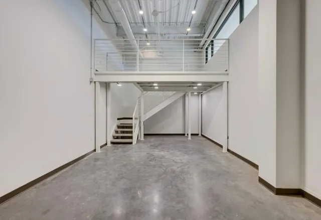 a view of an empty room with a fireplace