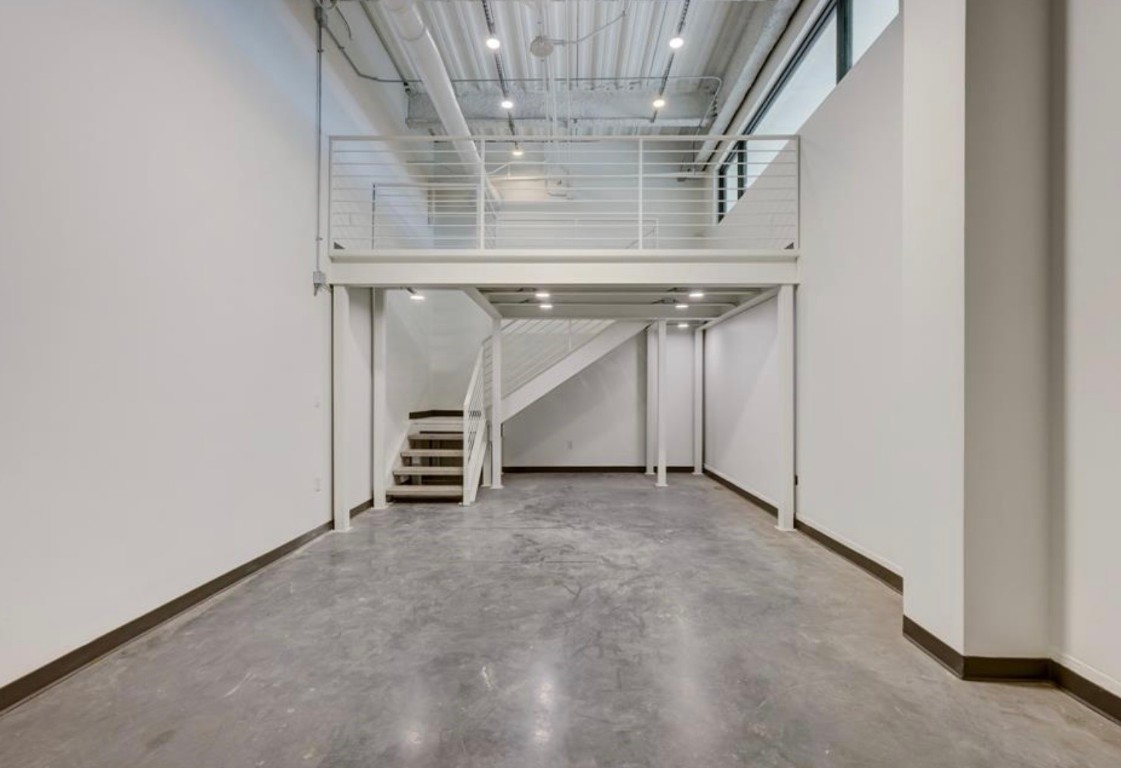 4229 North FM 620, Unit 225 Austin, TX 78734 - Photo 4 of 29 a view of an empty room with a fireplace