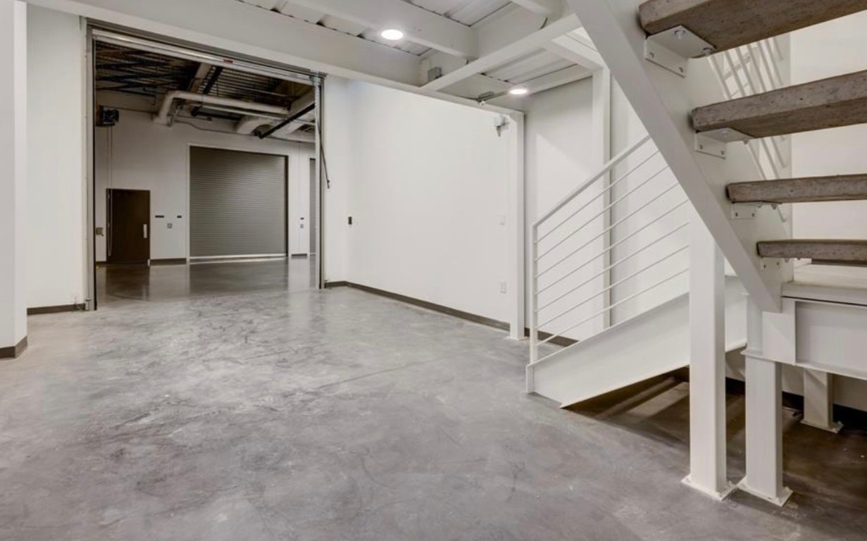 4229 North FM 620, Unit 225 Austin, TX 78734 - Photo 8 of 29 a view of a room with stairs and a ceiling fan