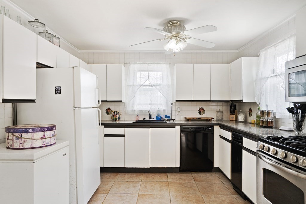 259 Kingsley Road Hull, MA 02045 - Photo 17 of 20 a kitchen with a sink cabinets and stainless steel appliances