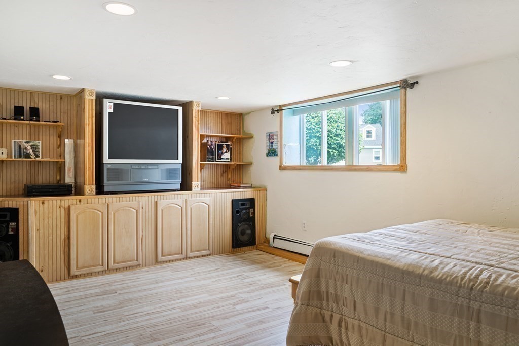 259 Kingsley Road Hull, MA 02045 - Photo 18 of 20 a bedroom with a bed and a dresser
