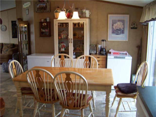 2012 Mosley Ferry Road Chapmansboro, TN 37035 - Photo 4 of 20 THE BREAKFAST AREA HAS LOTS OF ROOM AND RECEIVES PLENTY OF LIGHT FROM SLIDING DOORS TO THE DECK.