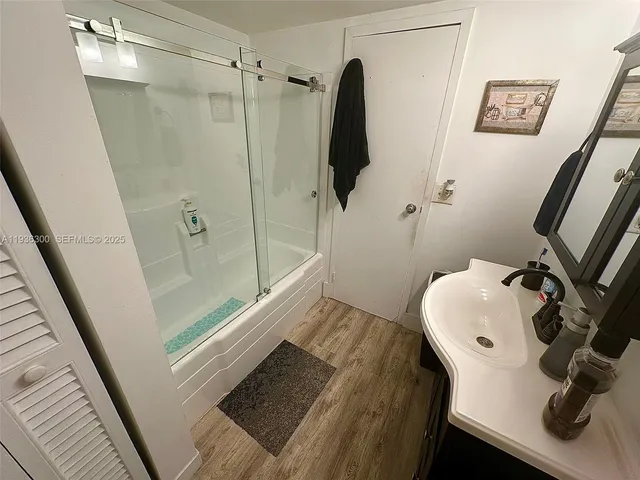 a bathroom with a sink and a mirror