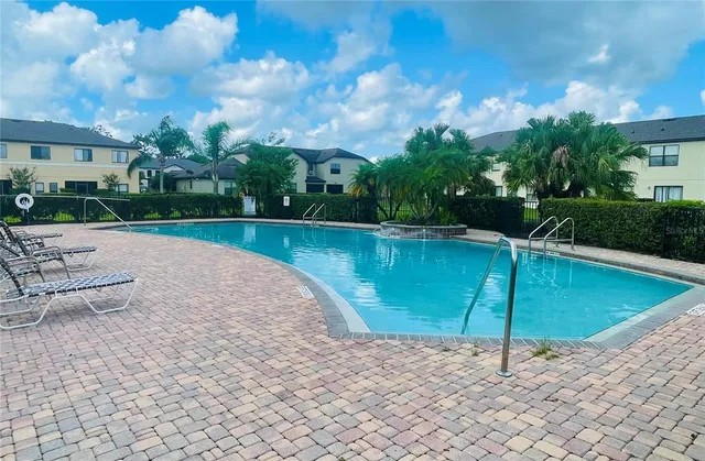 a view of outdoor space with playground and green space