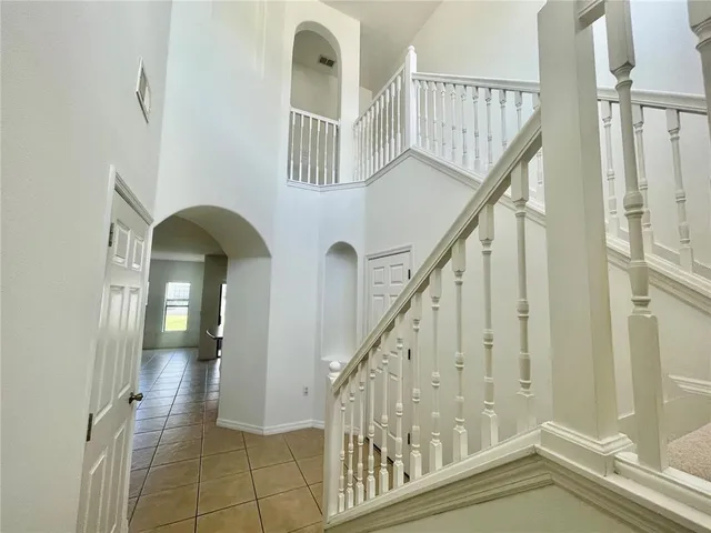 a view of entryway and hall with a front door