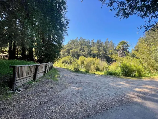 a view of a road with a car parked on the road