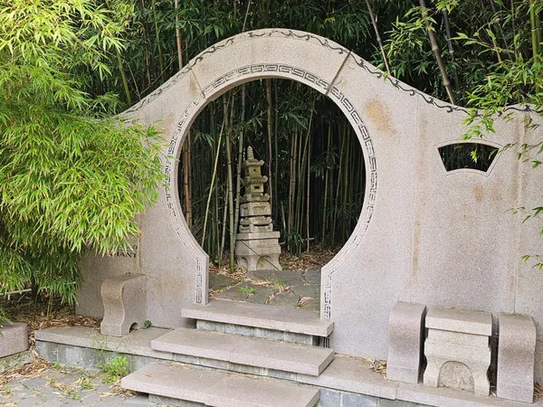 a view of a livingroom with wooden floor and a fireplace