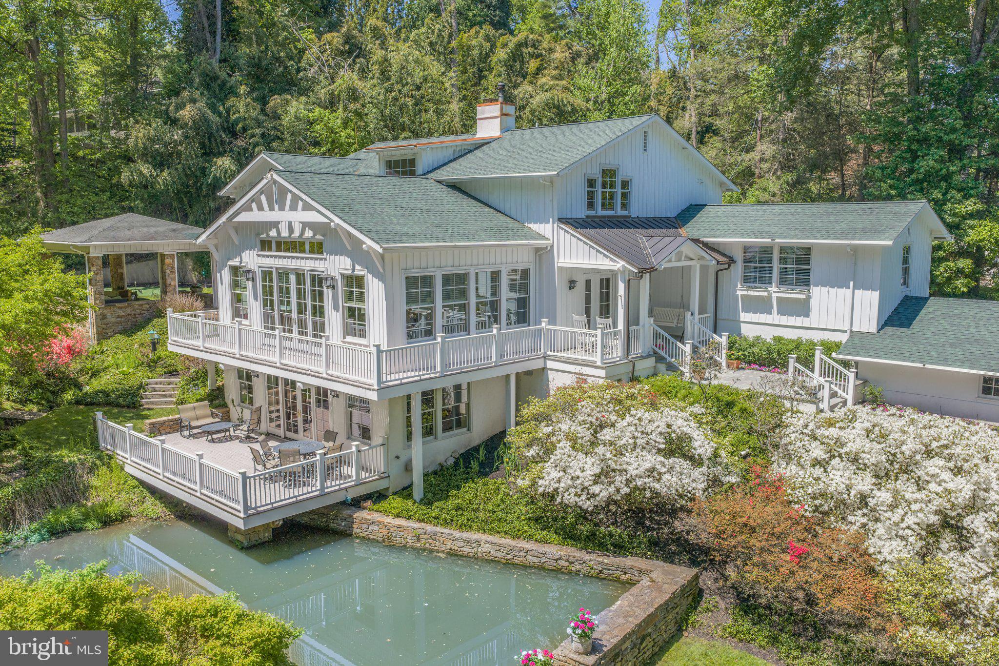 Serene lakeside retreat in lush greenery.