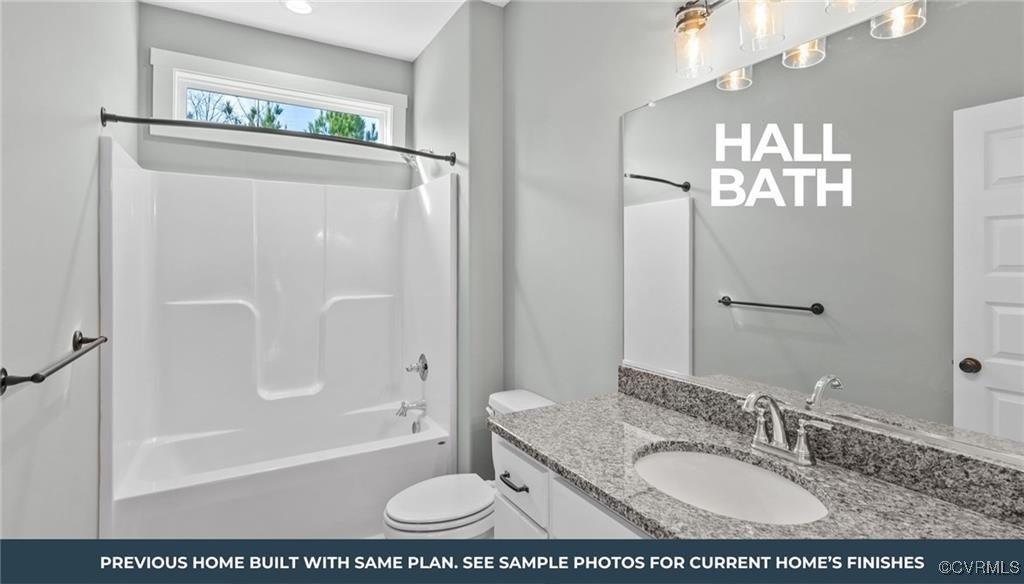 Tbd Country Club Road La Crosse, VA 23950 - Photo 12 of 17 a bathroom with a granite countertop sink a mirror a bathtub and shower