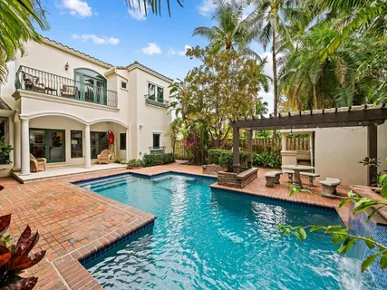 a living room with furniture and a lamps
