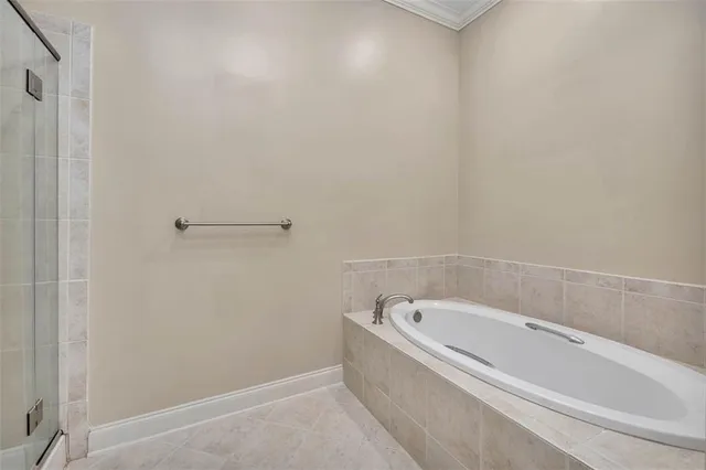 a white bath tub and shower
