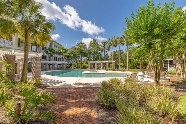 a view of a swimming pool with a patio