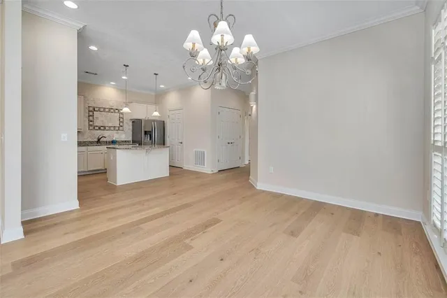 a view of a kitchen with a dishwasher cabinets and wooden floor