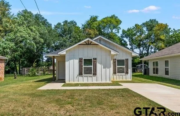 front view of a house with a yard