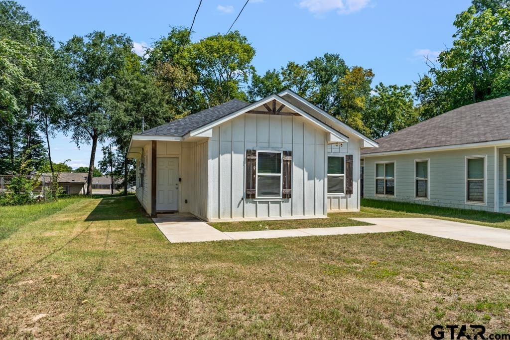 1919 West Jackson Street Tyler, TX 75701 - Photo 3 of 35 a front view of a house with a yard