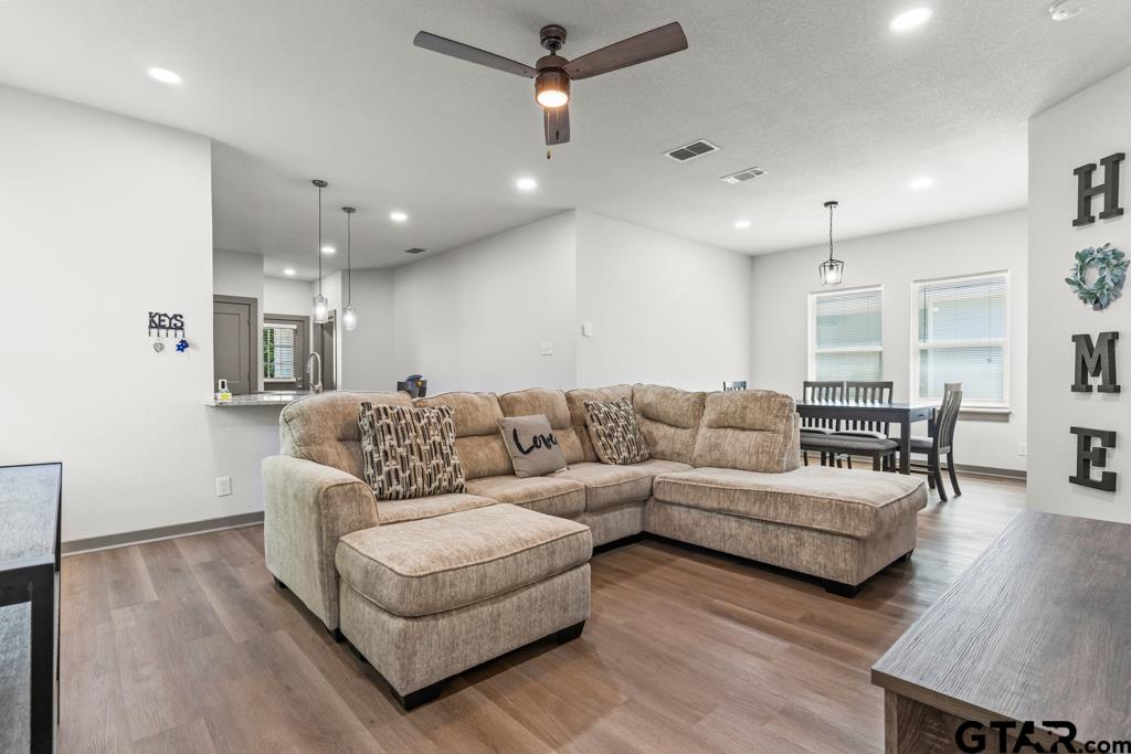 1919 West Jackson Street Tyler, TX 75701 - Photo 6 of 35 a living room with furniture and a wooden floor