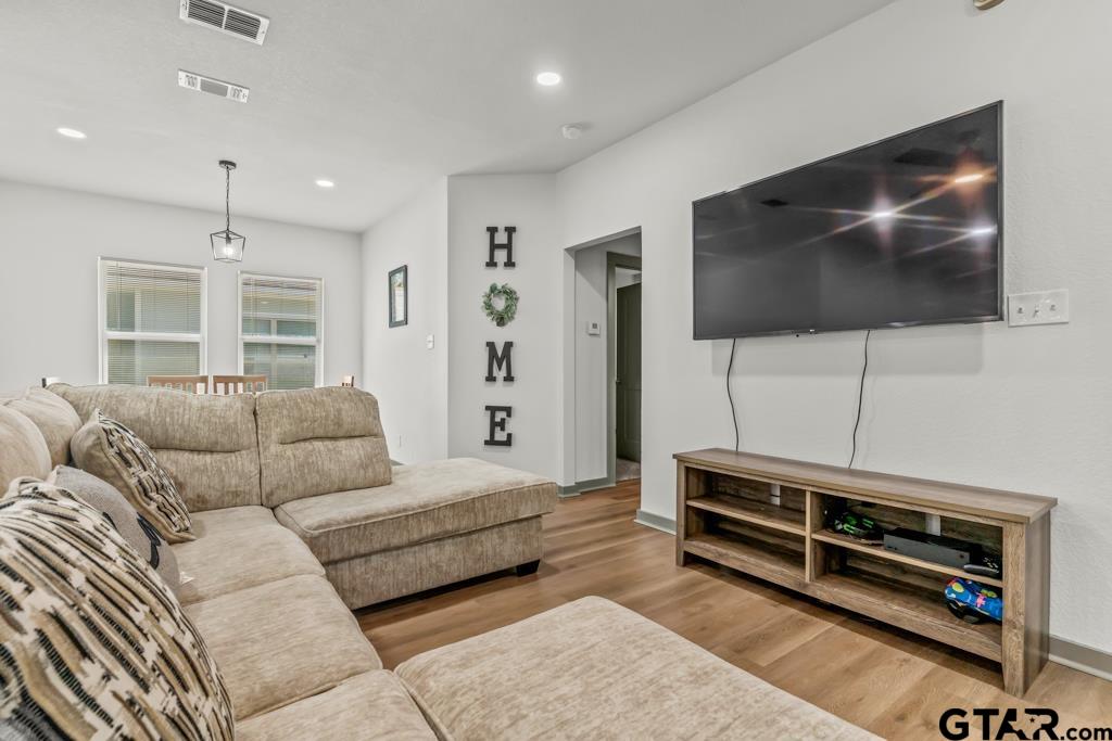 1919 West Jackson Street Tyler, TX 75701 - Photo 7 of 35 a living room with furniture and a flat screen tv