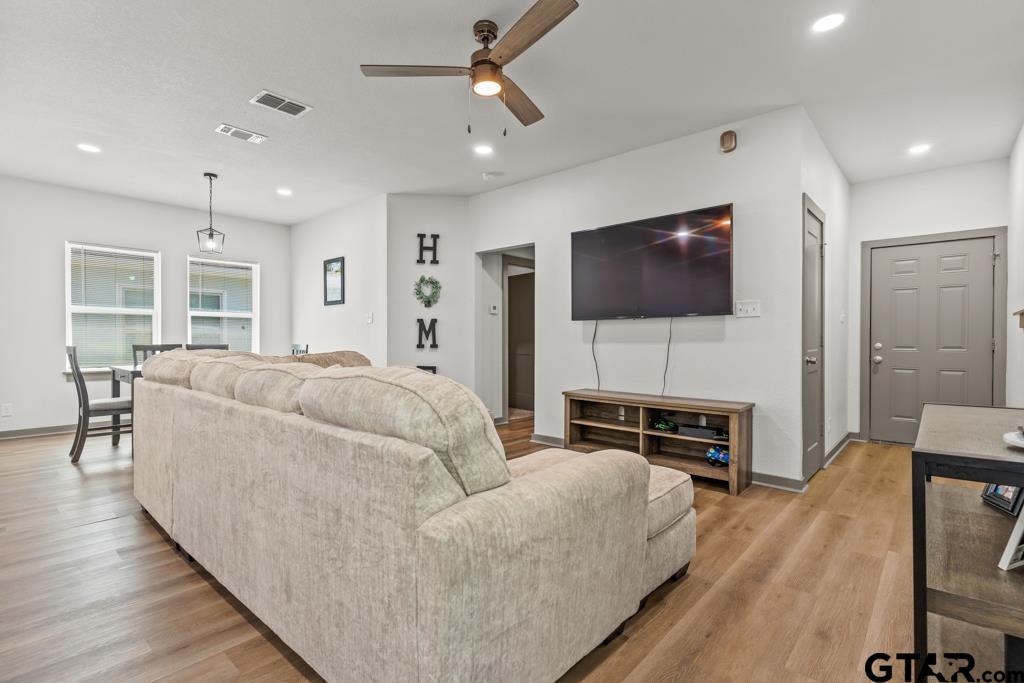 1919 West Jackson Street Tyler, TX 75701 - Photo 8 of 35 a living room with furniture and a flat screen tv