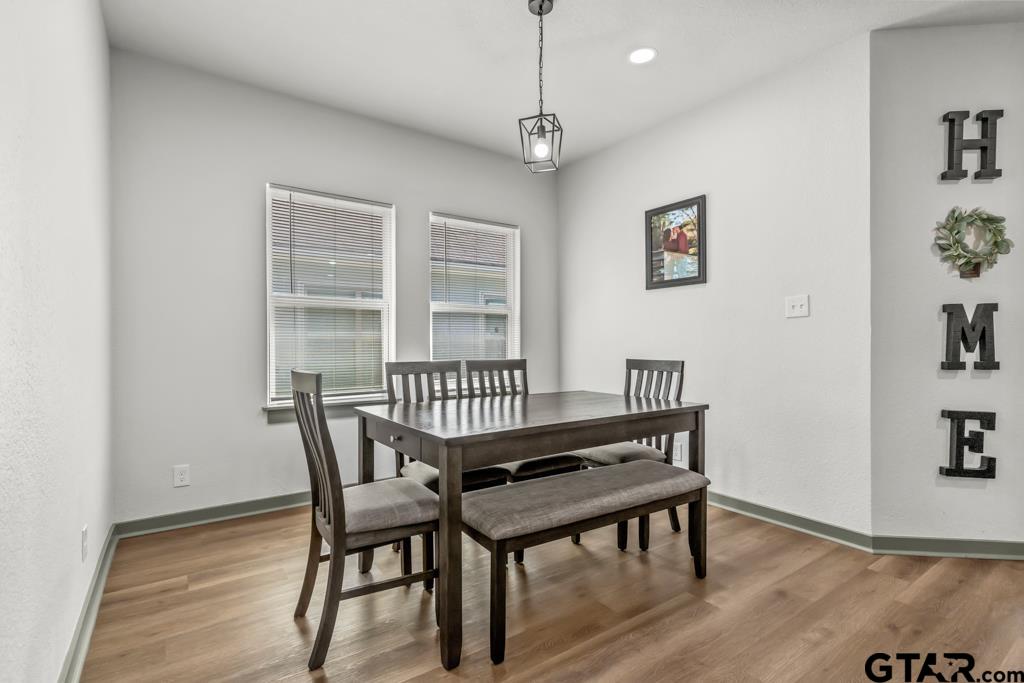 1919 West Jackson Street Tyler, TX 75701 - Photo 10 of 35 a view of a room with furniture wooden floor and window