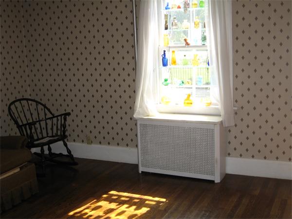 181 Rindge Avenue Cambridge, MA 02140 - Photo 3 of 5 a view of a door and chair in a room