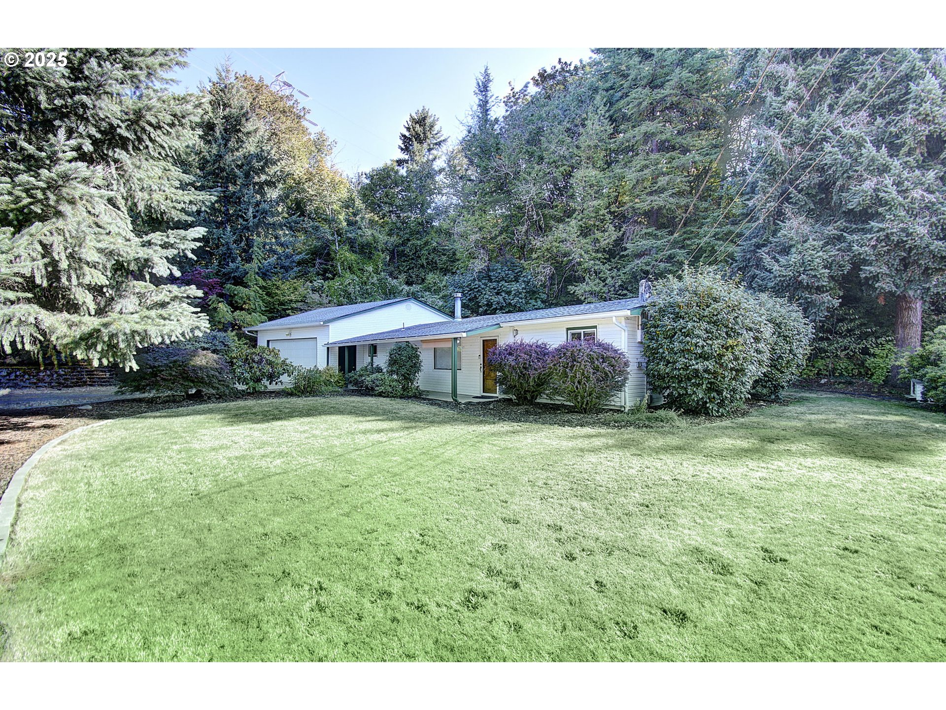 a aerial view of a house with yard and outdoor seating