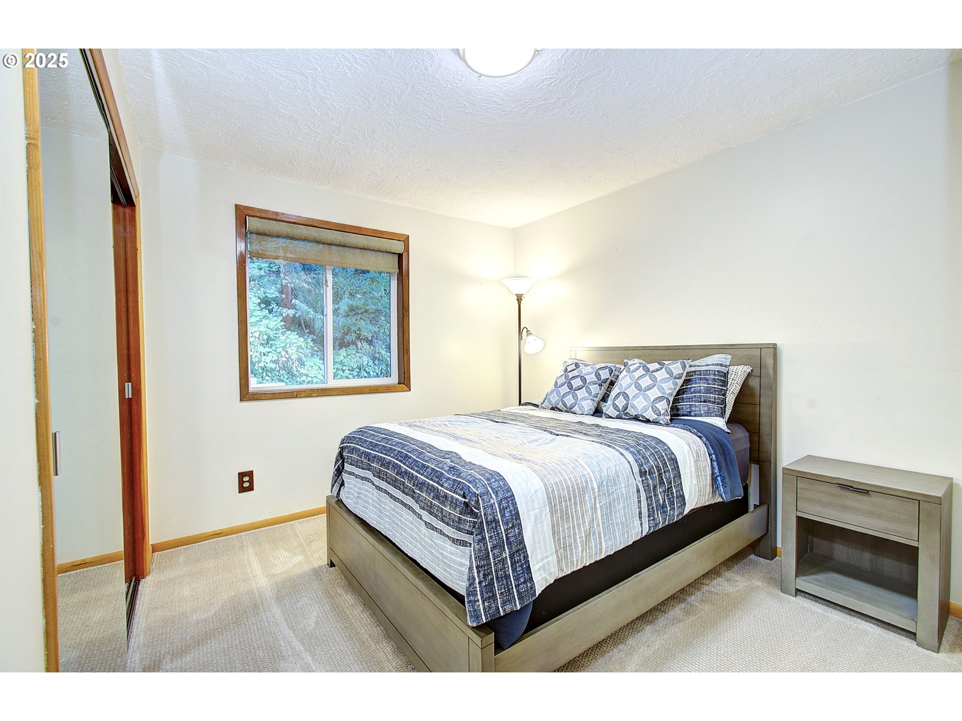 5911 Alki Road Vancouver, WA 98663 - Photo 13 of 29 a bedroom with a bed and a painting on the wall